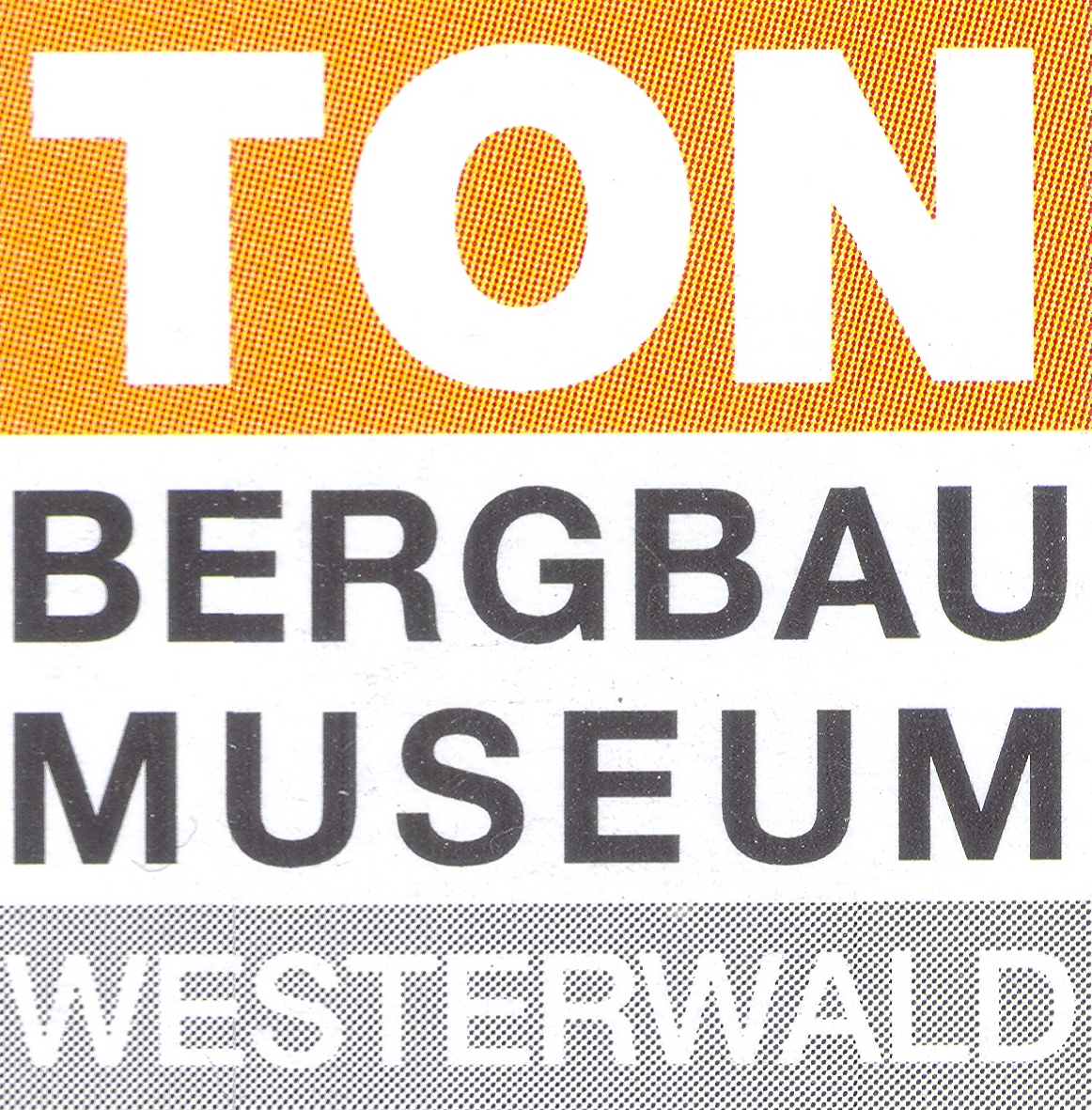 Schriftzug mit den Worten "BERGBAU MUSEUM WESTERWALD" in Großbuchstaben auf farbigem Hintergrund.